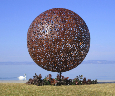Rusty iron ball garden artwork